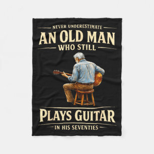 Einen alten Mann, der Gitarre spielt, Seventies un Fleecedecke