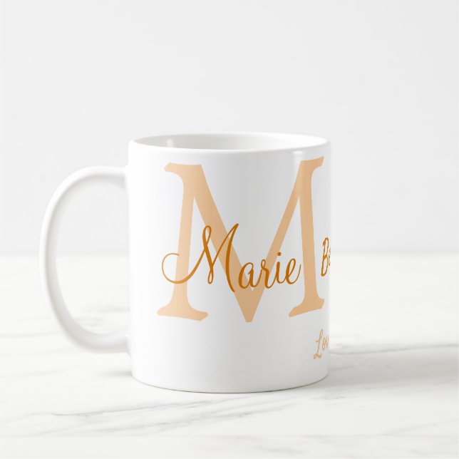 einfache minimale Bestform Orangenmonogramm Kaffeetasse (Links)