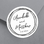 Einfache Minimalistische Namensauflösung Runder Aufkleber<br><div class="desc">Einfache Minimalistische Hochzeitskleber mit schwarzem Doodle-Rahmen. Diese zauberhaften viereckigen Hochzeitsaufkleber sind mit Braut- und Bräutigam-Namen und Hochzeitsdatum versehen, die in einem Mix aus sauberen und stilvollen Schriftart dargestellt sind. Um das Design herum ist ein spielerisch handgezeichnet schwarzer Doodle-Rahmen aus chaotischen Kreisen, der eine lustige und skurrile Touch hinzufügt. Vollständig anpassbar,...</div>