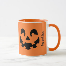 Einfache schwarze Kürbisgesicht an orangefarbenem  Tasse