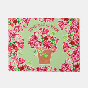 Eingemachte rote Pelargonie-mit Monogramm mit Fußmatte