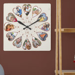 Einmal in einer Zeit von 12 Herz geformt Fotos Cre Quadratische Wanduhr<br><div class="desc">Erstellen Sie Ihre eigene Multi-Foto-Uhr, um Ihre Geschichte zu erzählen - die Mitte der Uhr wird mit "Once upon a time" in handgeschriebener Typografie geschrieben. Verwenden Sie die Bildvorlage, um 12 Ihrer bevorzugten Fotos hinzuzufügen, die in herzförmigen Rahmen angezeigt werden. Das Design verwendet porträtierte vertikale Fotos für alle Zahlen außer...</div>