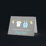 Elegant and Cute Baby Boy Clothes Karte<br><div class="desc">Send your congratulations and well wishes to the new eltern of a newborn baby boy with these mini baby baby clothes and requories greeting card! This modern design in pastel colours includes cute baby items like yellow baby socks, a white baby jumpsuit with a bow and a pastel blue overalls...</div>