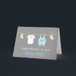 Elegant and Cute Baby Boy Clothes Karte<br><div class="desc">Send your congratulations and well wishes to the new eltern of a newborn baby boy with these mini baby baby clothes and requories greeting card! This modern design in pastel colours includes cute baby items like yellow baby socks, a white baby jumpsuit with a bow and a pastel blue overalls...</div>