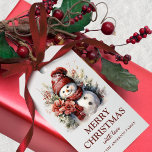Elegant Floral Christmas Snowman Geschenkanhänger<br><div class="desc">Fügen Sie Ihrem Weihnachtsgeschenk in dieser Saison eine besondere Touch mit unseren eleganten Weihnachtsschneemanns in Rot und Weiß hinzu. Diese atemberaubenden Geschenketiker verfügen über einen wunderschön gestalteten Aquarell-Schneemann, der in Typografie-Schriftart "Frohe Weihnachten" geschrieben hat. Diese Geschenketiketten sind auch vollständig anpassbar! Fügen Sie eine persönliche Touch hinzu, indem Sie einen Familiennamen...</div>