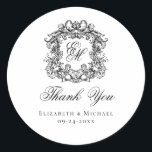 Elegant Monogram Wedding Crest Thank You Runder Aufkleber<br><div class="desc">These elegant classic black and white wedding monogram thank you stickers are perfect for favors, place cards, and more. They feature an ornate vintage crest with intertwined fancy script calligraphy monogram, and script Thank You. Find matching products in the collection, or message me through Zazzle Chat for more products and...</div>