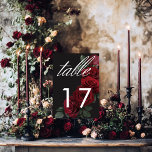 Elegant Moody Blood Rote Rosen floral Tischnummer<br><div class="desc">Mit unserer zauberhaften Hochzeitskarte können Sie Ihre gotisch inspirierte Feier mit zeitloser Eleganz feiern. Ein weicher schwarzer Hintergrund bietet die perfekte Leinwand für einen fesselnden, aber dennoch schlichten Bouquet. Stellen Sie sich ein Arrangement aus gedämpfter rote Rose vor, bei der sich reiche rote Farbtöne mit dunkelgrünem Blattwerk vermischen. Dieses ätherische...</div>