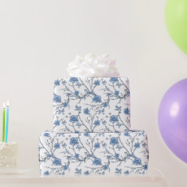 Elegante blaue Schleifen und blumige Zweige Geschenkpapier