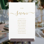 Elegante Gold Script Tischnummer 7 Sitzplakette<br><div class="desc">Diese eleganten,  in Gold und Weiß gehaltene Signatur-Schrift mit doppelseitiger Tischnummer 7 Sitzkarten eignen sich perfekt für alle Feiern. Entwickelt von Thisisnotme©</div>