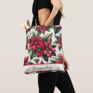 Elegante rote Poinsettien mit grünen Blättern pers