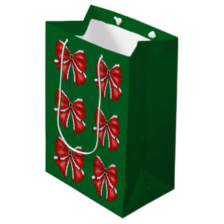 Elegante rote Weihnachtsbögen auf dunklem Grün Mittlere Geschenktüte