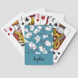 Elegante schwarz-weiße Orchideen mit türkisfarbene Spielkarten