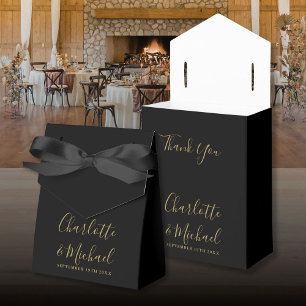 Elegante schwarze und goldene Hochzeitsgunstbox mi Geschenkschachtel