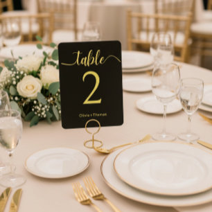 Elegante schwarze und goldene Hochzeitstisch-Numme Sockelschild