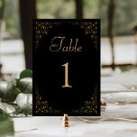Elegante Vintage Foliage Black Gold Hochzeit Tischnummer<br><div class="desc">Diese elegante,  Vintag inspiriert Hochzeitskarte mit einer zarten goldgelben,  botanischen Blattlinie auf schwarzem Hintergrund. Das Wort "Tabelle" erscheint in goldfarbenem Skript,  wobei die bearbeitbare Tischnummer unten in goldenen Serif-Schriftart erscheint.</div>