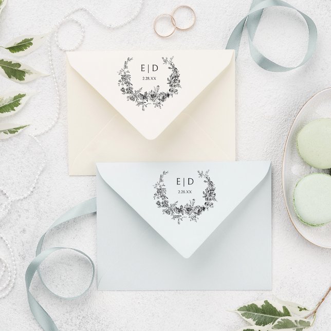 Eleganter blau eingeprägter Blumenreath mit Monogr Gummistempel (Von Creator hochgeladen)