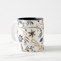 Eleganter blauer und goldener Blumenmuster-Becher