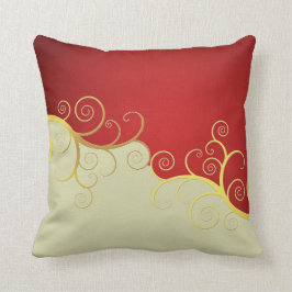 Eleganter goldener Wirbel auf Rot und Creme Kissen