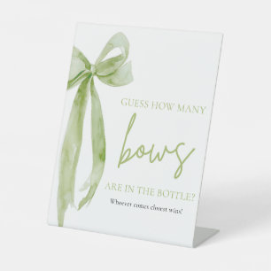 Eleganter grüner Bow rät, wie viele Bows Spiel Sockelschild