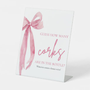 Eleganter Rosa-Bow schätzt, wie viele Corks Spiel Sockelschild