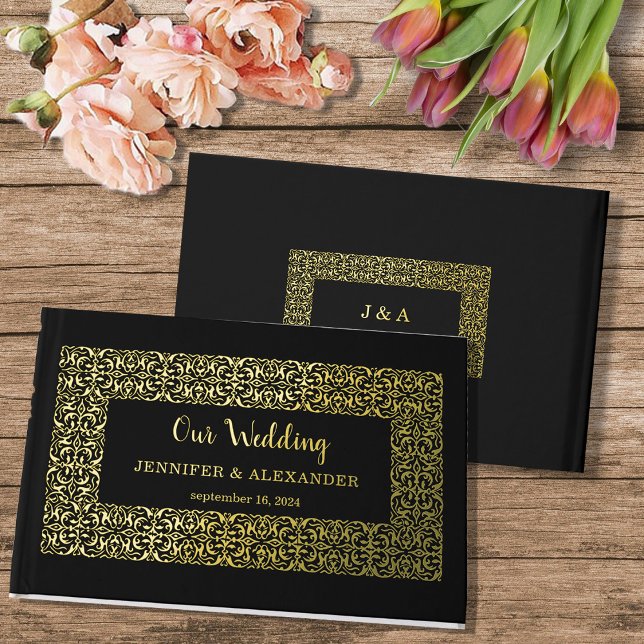 Eleganter schicker Goldrahmen auf schwarzer Goldfo Gästebuch (Chic elegant frame, monogrammed gold foil wedding guestbook.)