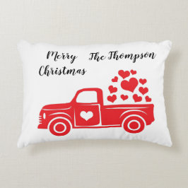 Eleganter Text mit roten LKW-Familiennamen auf wei Dekokissen