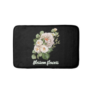 Eleganter weißer Blumenstrauß mit grünen Blättern Badematte