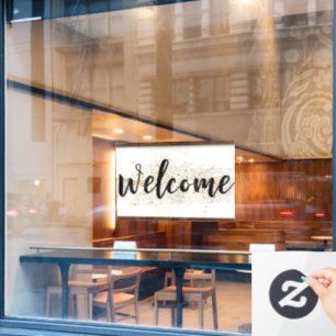 Elegantes Begrüßungszeichen in Schwarz-Script mit Fensteraufkleber