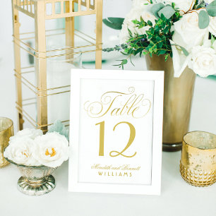 Elegantes goldenes Hochzeitsmonogramm in Schreibsc Tischnummer