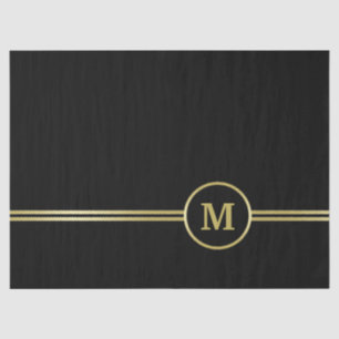 Elegantes Goldmonogramm auf schwarz Seidenpapier