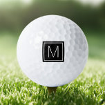Elegantes Monogramm, initial auf schwarzem Quadrat Golfball<br><div class="desc">Golf-Kugel mit dem Monogramm-Initial in einem quadratischen,  weißen Rand auf einem gedruckten schwarzen quadratischen Hintergrund.</div>