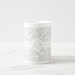 Elegantes silbernes Damast-Strudel-Monogramm Prozellantasse
