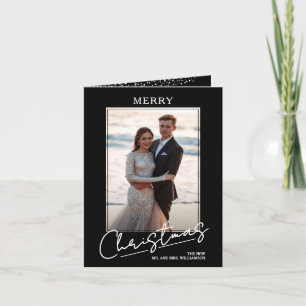 Elegantes Weihnachtsgruß-Script auf schwarzer gefa Feiertagskarte