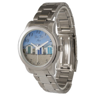 englische blaue Himmel und Strandhütten am Meer Armbanduhr