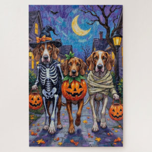 Englische Foxhound-Hunde beim Halloween-Süßigkeite Puzzle