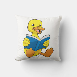 Ente beim Lesen mit Buch Kissen