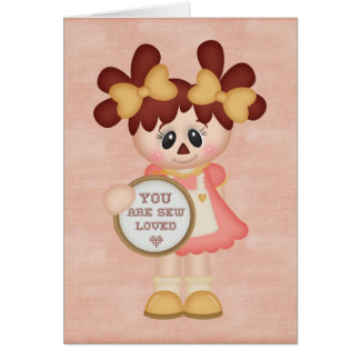 Entzückendes Land-nähende Flickenpuppe