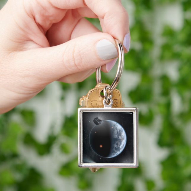 Erdähnlicher Planet mit Ozeanen, die seine Oberflä Schlüsselanhänger (Hand)