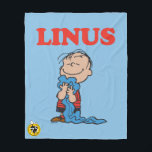 Erdnüsse | Linus Blanket Smile Fleecedecke<br><div class="desc">Karo dieses lustige Design von Peanuts mit Linus.</div>