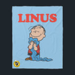 Erdnüsse | Linus Blanket Smile Fleecedecke<br><div class="desc">Karo dieses lustige Design von Peanuts mit Linus.</div>