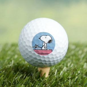 Erdnüsse   Snoopy bei der Schreibmaschine Golfball