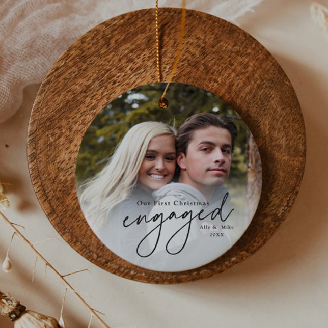 Erste Weihnachts Verlobt Handgeschriebenes Foto Keramik Ornament (Elegant black script first christmas engaged 2 photo christmas tree holiday ornament.)