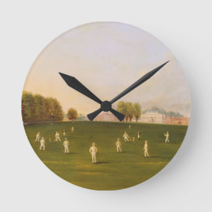 Erstes großartiges Match des Krickets spielte Runde Wanduhr
