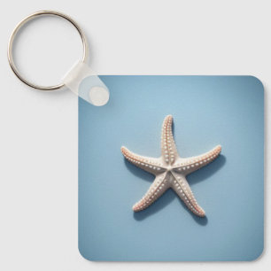 Exotischer Starfish mit blauem Hintergrund Schlüsselanhänger