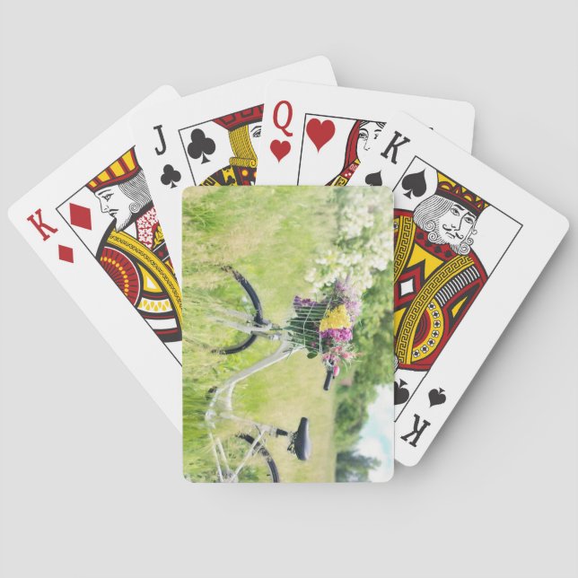 Fahrrad mit Korb der Blume auf der Wiese Spielkarten (Rückseite)