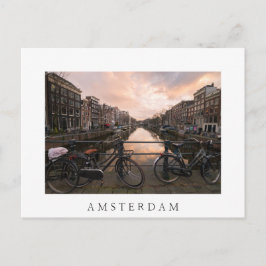 Fahrräder bei Sonnenuntergang in Amsterdam Postkarte
