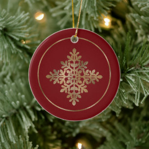 Falsche Goldfolie-Schneeflocke auf Rot (keine echt Keramik Ornament