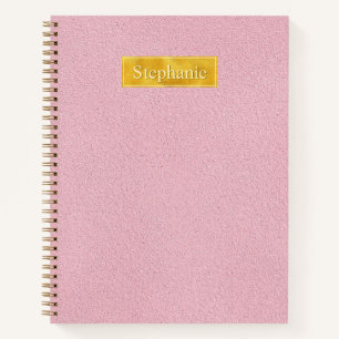 Falsche rosa Ledertextur mit Goldfolienbanner Notizbuch