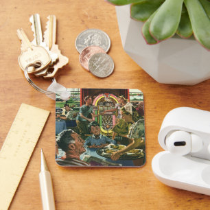 Familienabendessen im Diner mit einer Jukebox im V Schlüsselanhänger