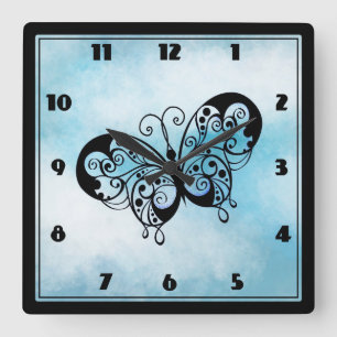 Fancy Butterfly on a Cloud Blue Background Quadratische Wanduhr